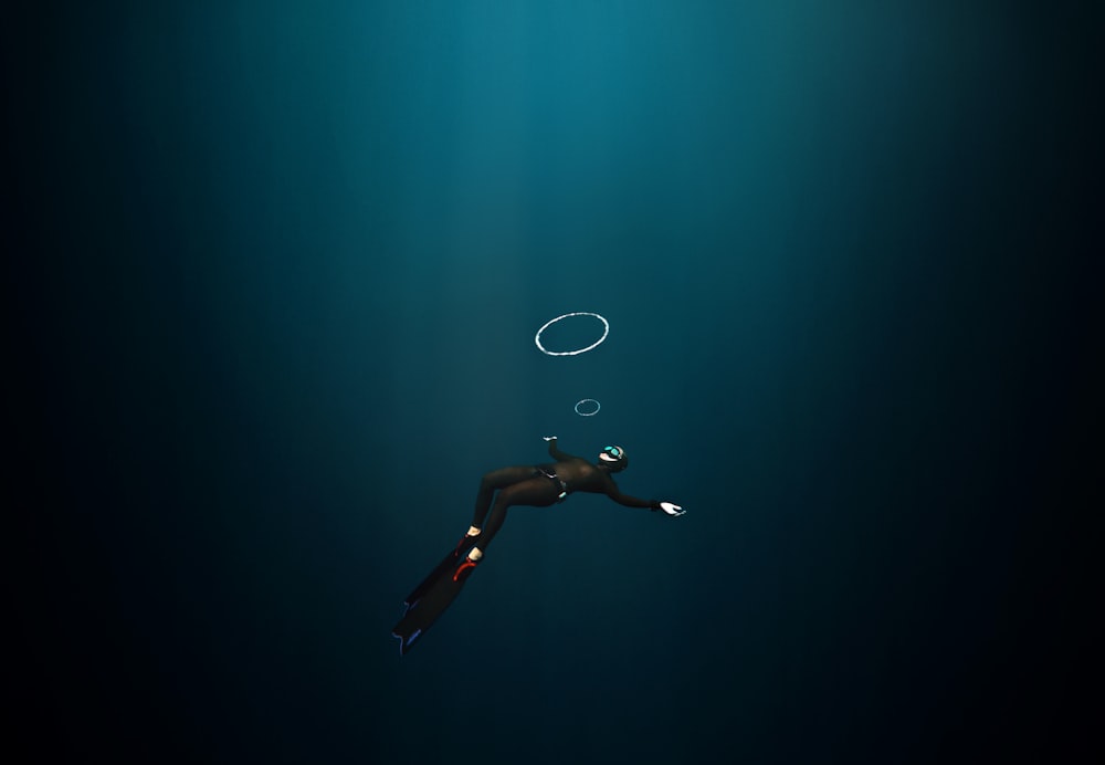 woman in black bikini bottom floating on water