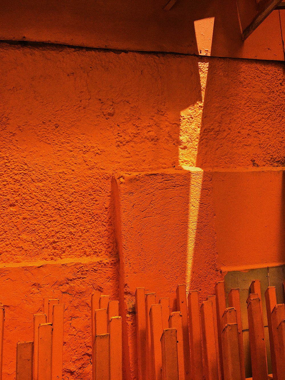 brown brick wall with orange paint