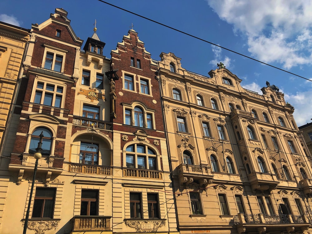 brown concrete building under blue sky during daytime