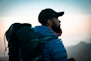 man in blue and black jacket and black cap
