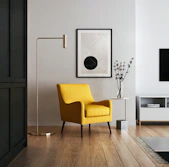 brown wooden framed yellow padded chair