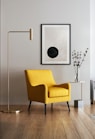 brown wooden framed yellow padded chair