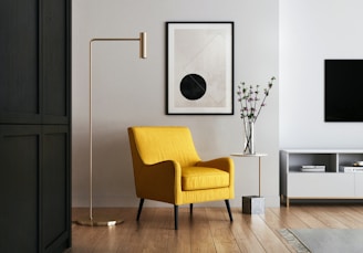 brown wooden framed yellow padded chair