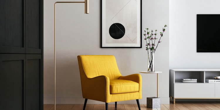 brown wooden framed yellow padded chair