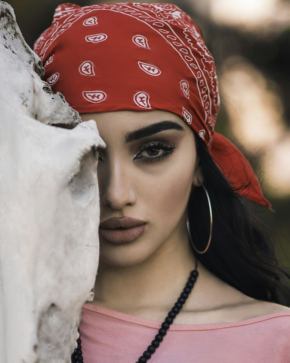 woman in red and white floral hijab