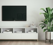 black flat screen tv on white wall