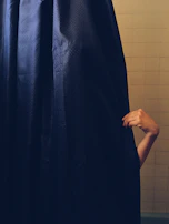 A family stepping out of the shower onto a soft, secure gripaura bath mat.