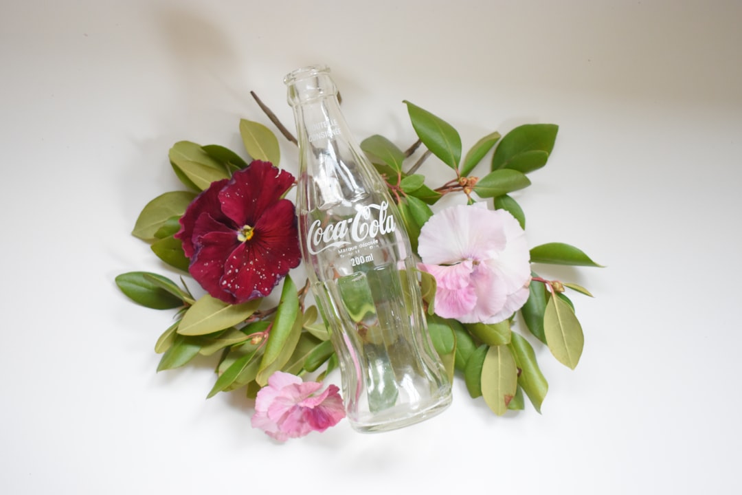 pink roses in clear glass bottle