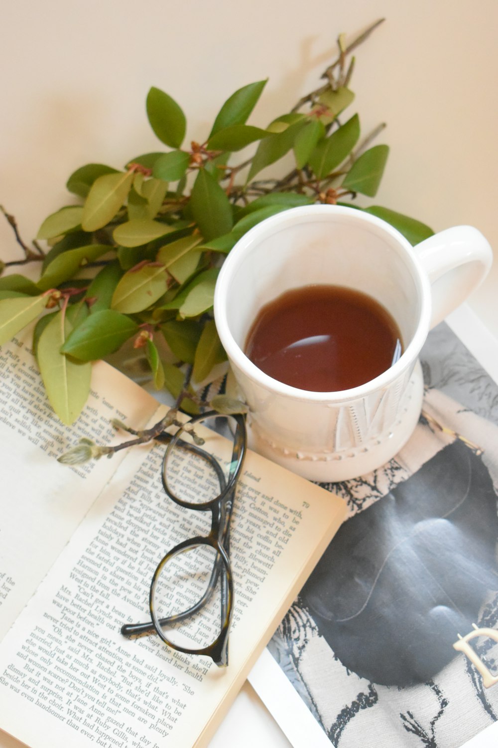 green plant on white ceramic mug