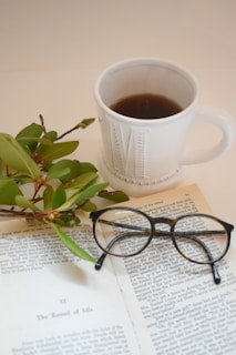a cup of tea, glasses and a book - space to learn and relax