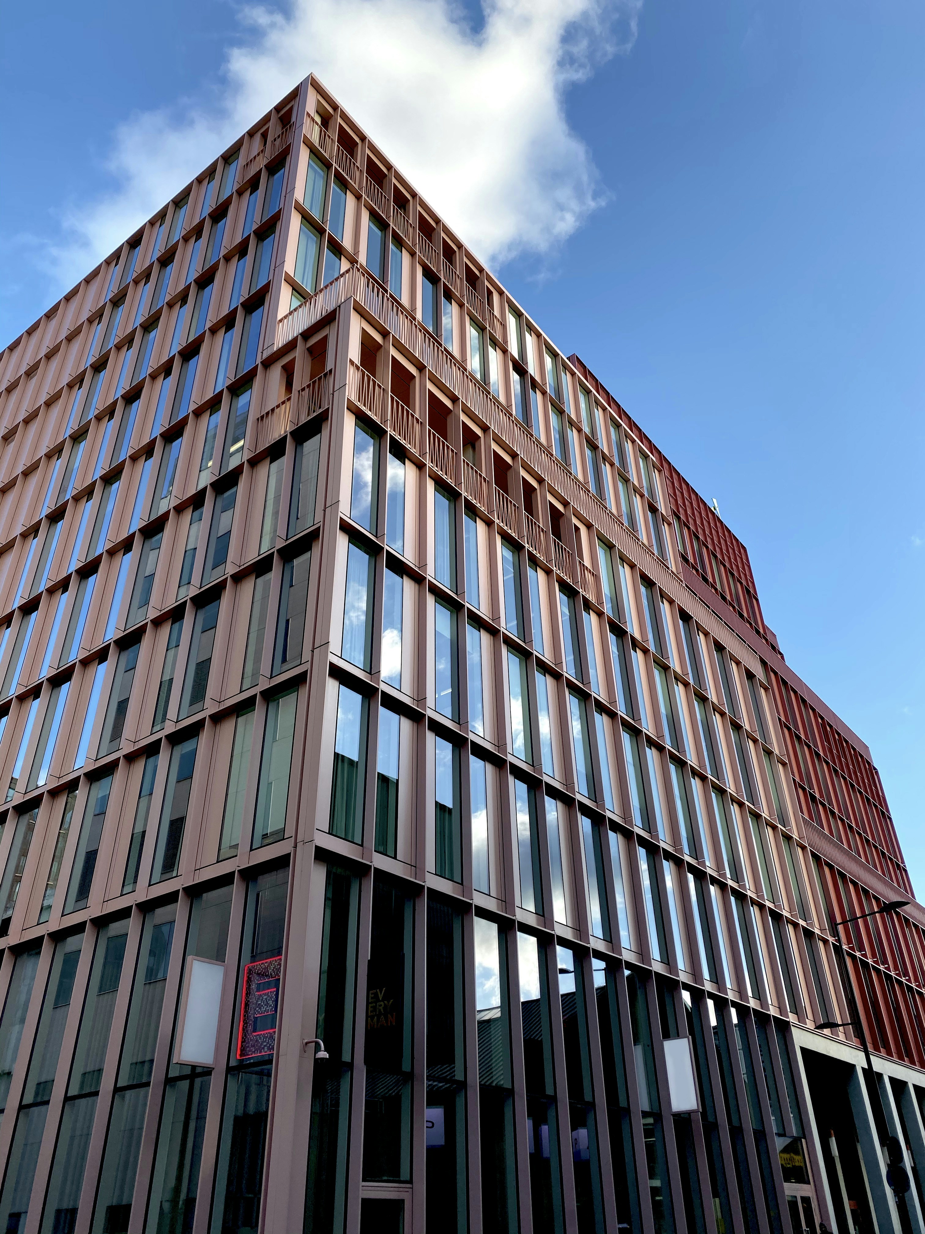 brown concrete building under blue sky during daytime