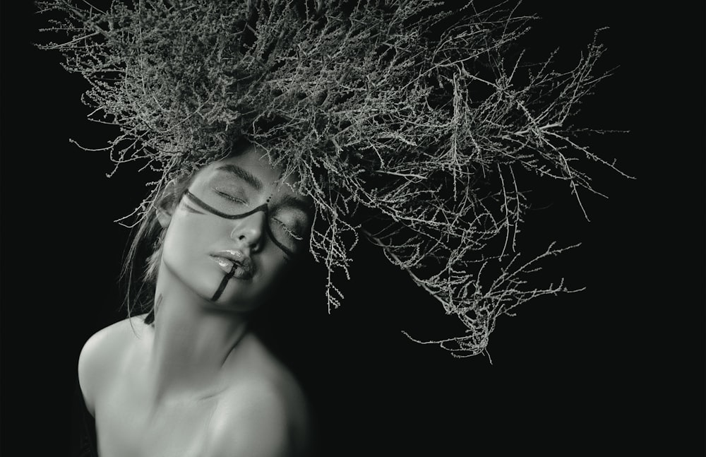 woman with curly hair in grayscale photography