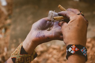 person holding clear glass tube