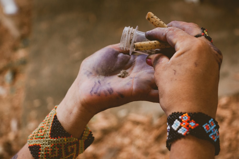 person holding clear glass tube