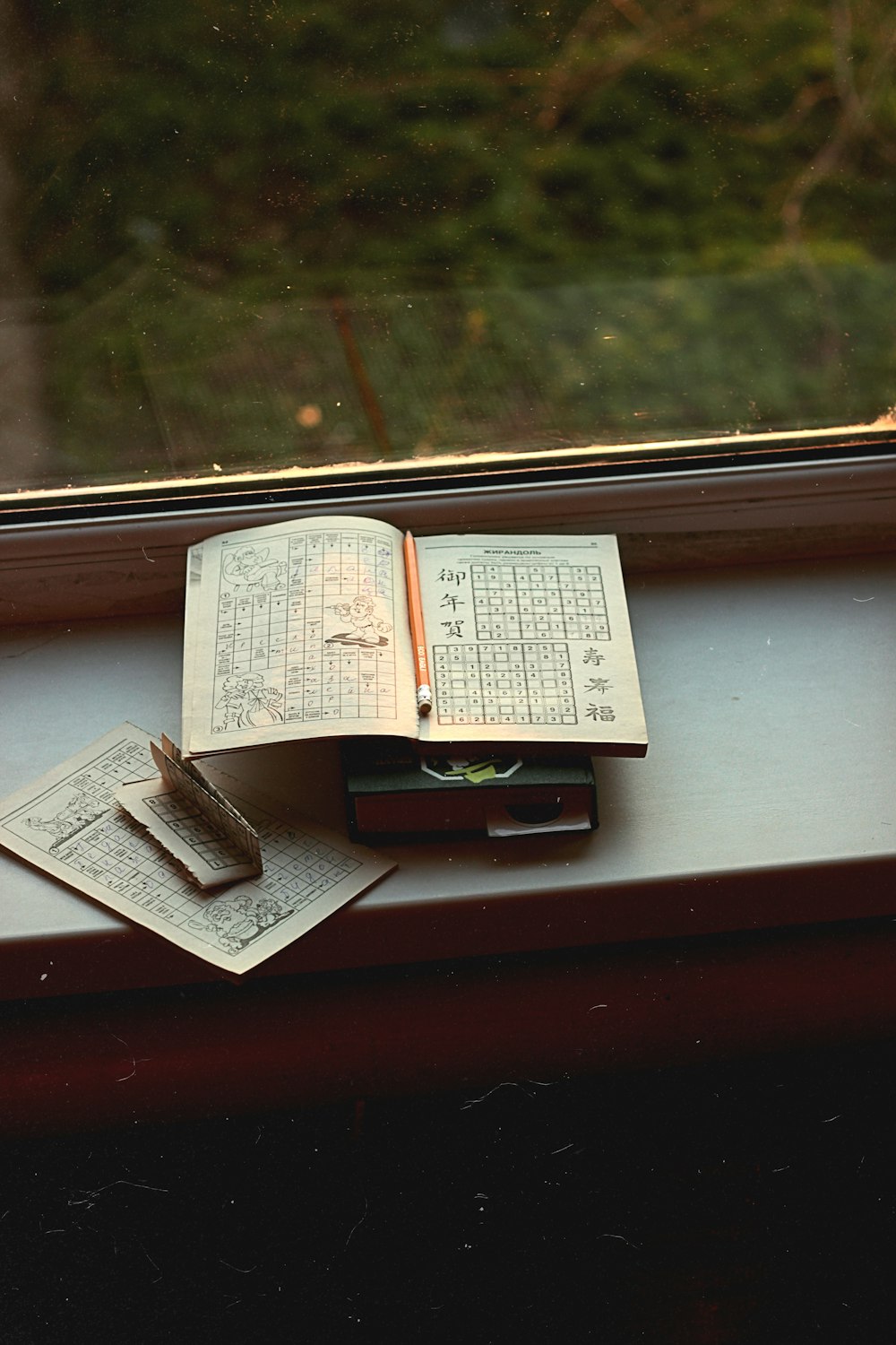 opened book on brown wooden table