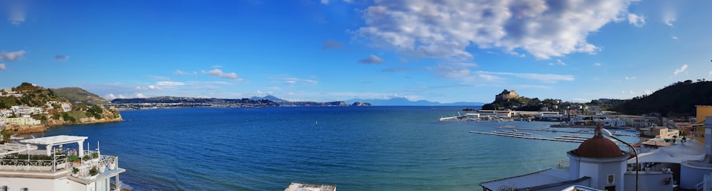 white boat on sea under blue sky during daytime