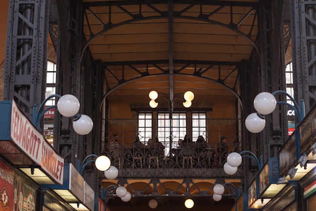 An indoor event space decorated with personalized adhesive graphics and illuminated letreiros by Mandacaru Visual.