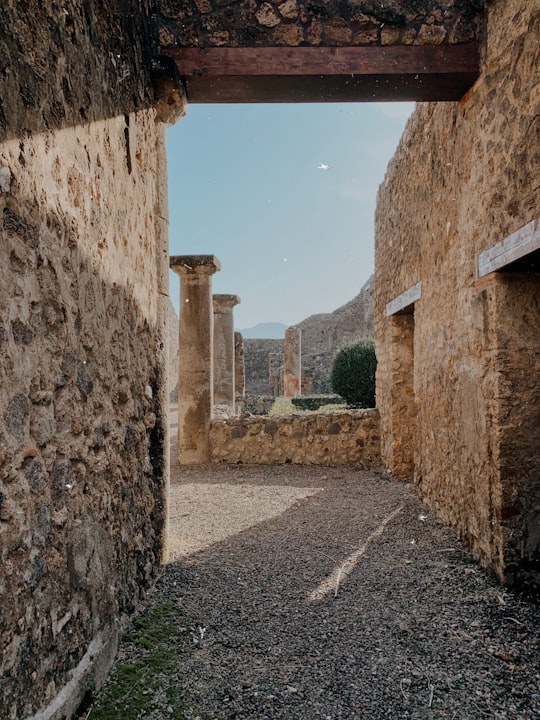 brown brick wall during daytime in Pompeii Italy