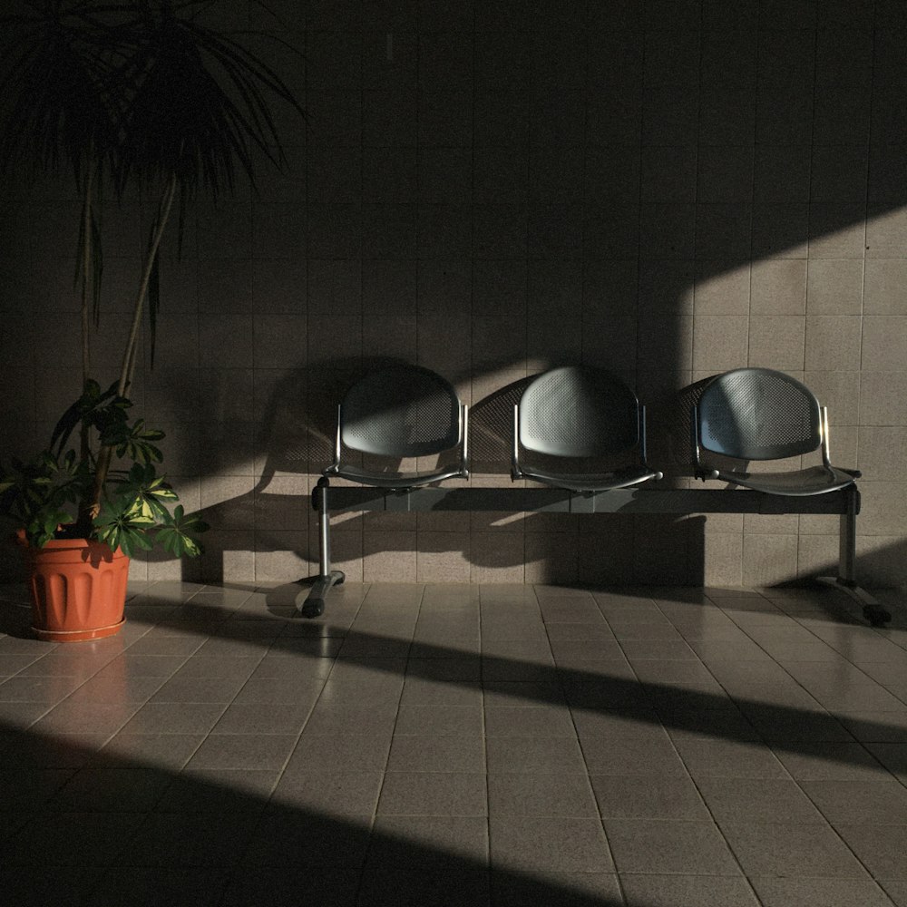 black and silver chairs on brown floor tiles