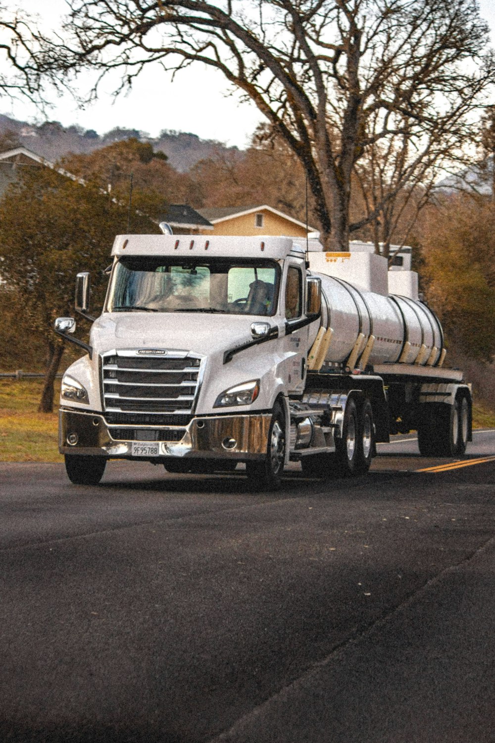 white and brown truck on road during daytime