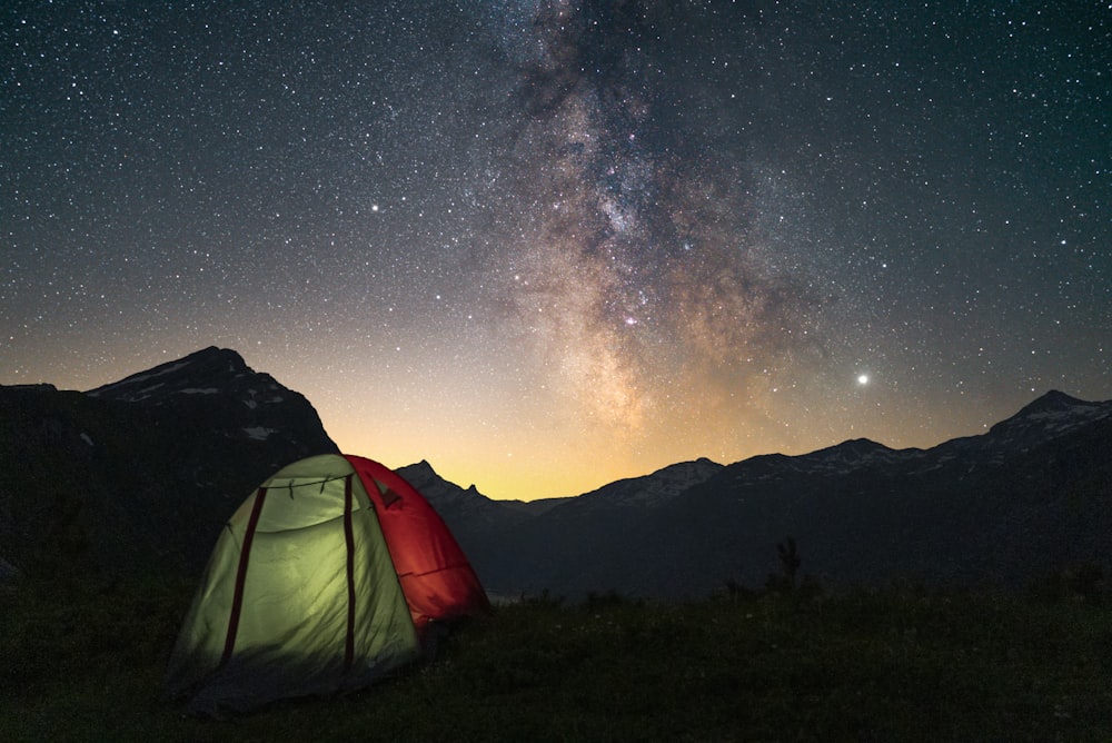 white dome tent on green grass field during night time