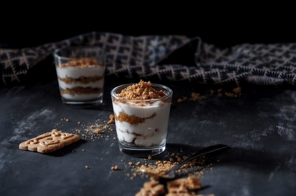 white and brown ice cream on black table