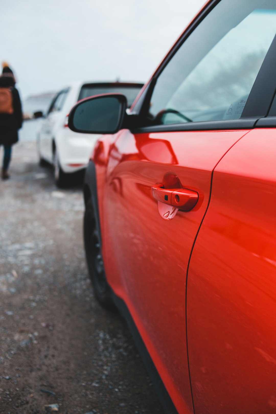 red car on road during daytime