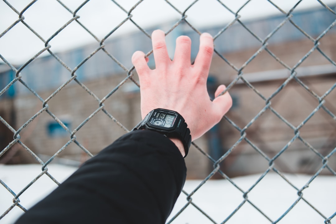 person wearing black digital watch