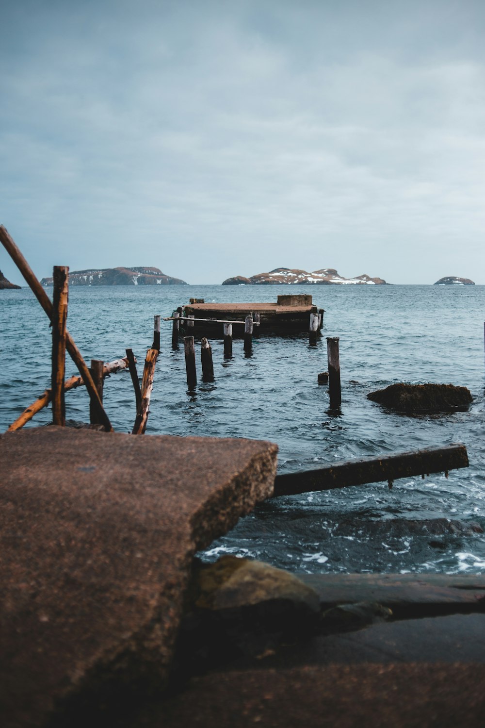 brown wooden dock on sea during daytime