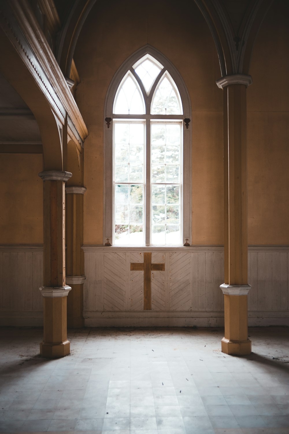 brown wooden cross on brown wooden door