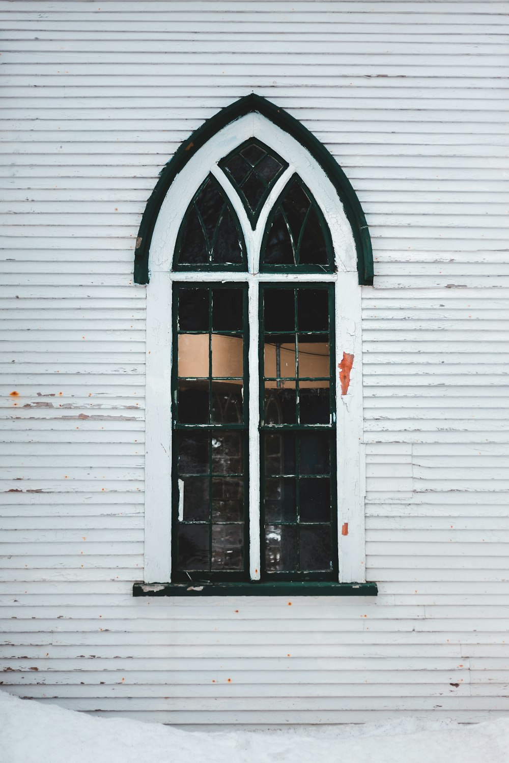 white wooden framed glass window