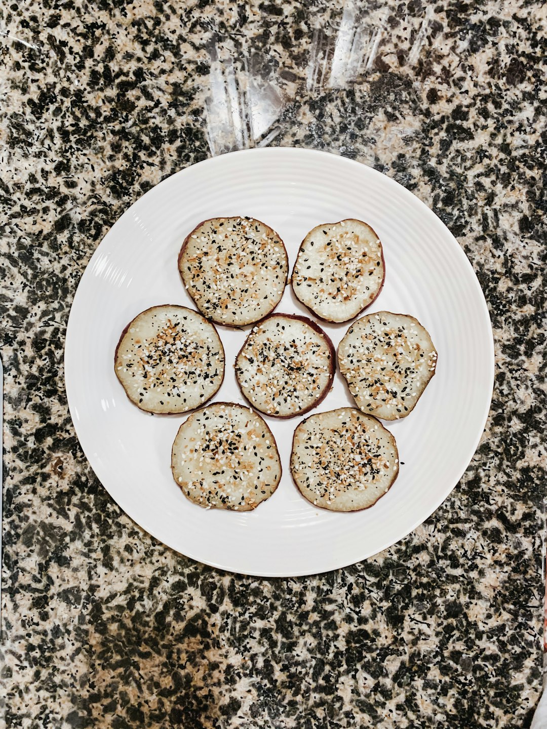 white ceramic plate with brown and green food