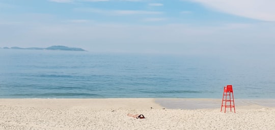 brown and white stones on beach during daytime in Ipanema Brasil