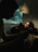 A cozy, dimly lit room with a smartphone displaying a Snapchat profile.