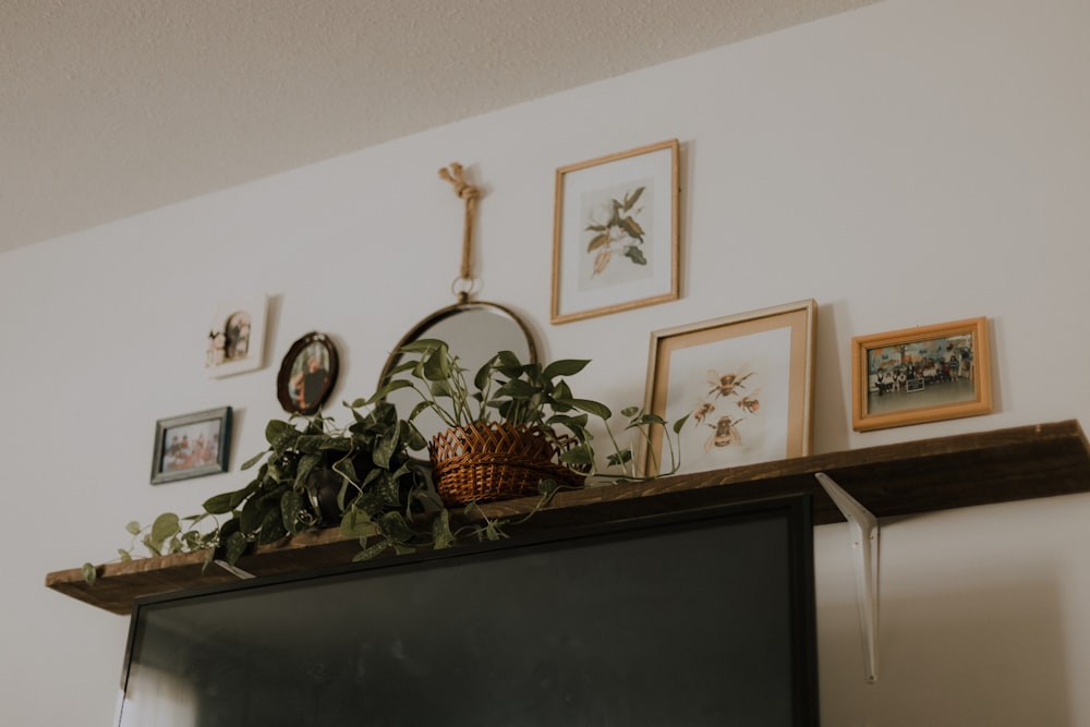 black flat screen tv on brown wooden tv rack