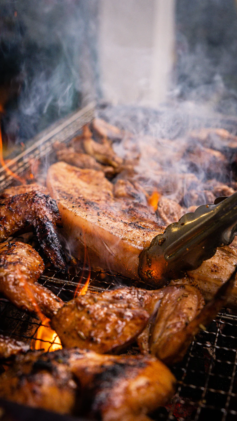 Meat smoking over the fire