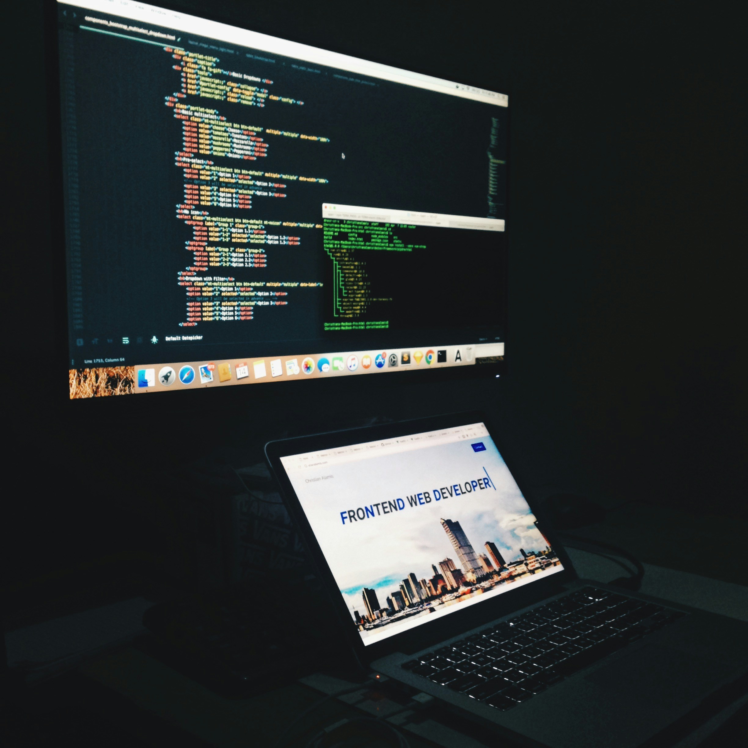 Minimalist architecture firm website on multiple screens, dim office with city view background
