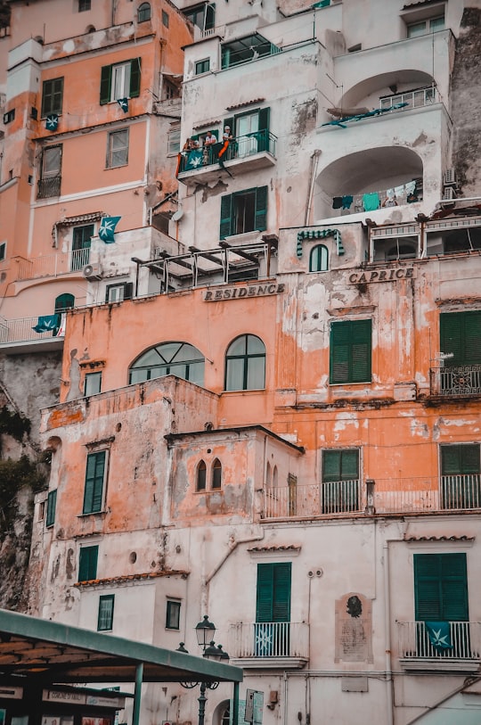 brown and white concrete building during daytime in Positano Italy