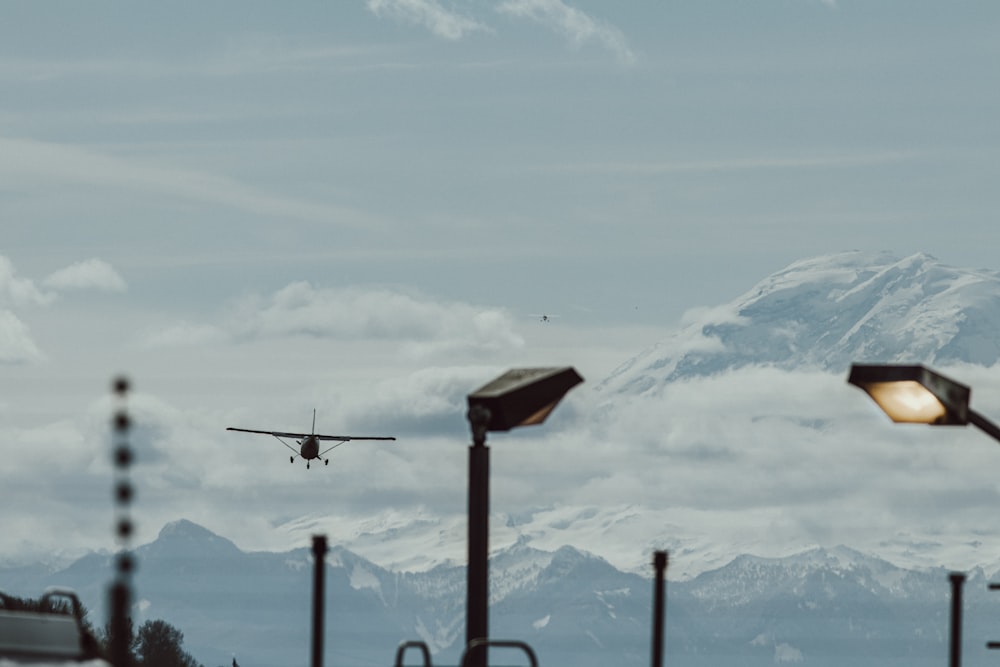 brown wooden cross on top of mountain during daytime