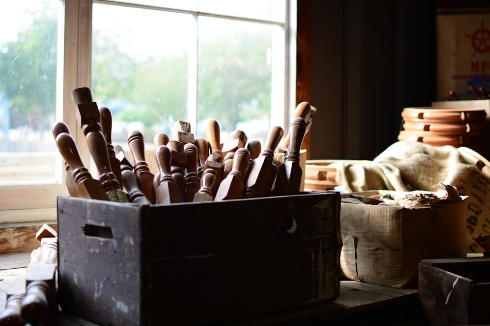 brown wooden handle on brown wooden box