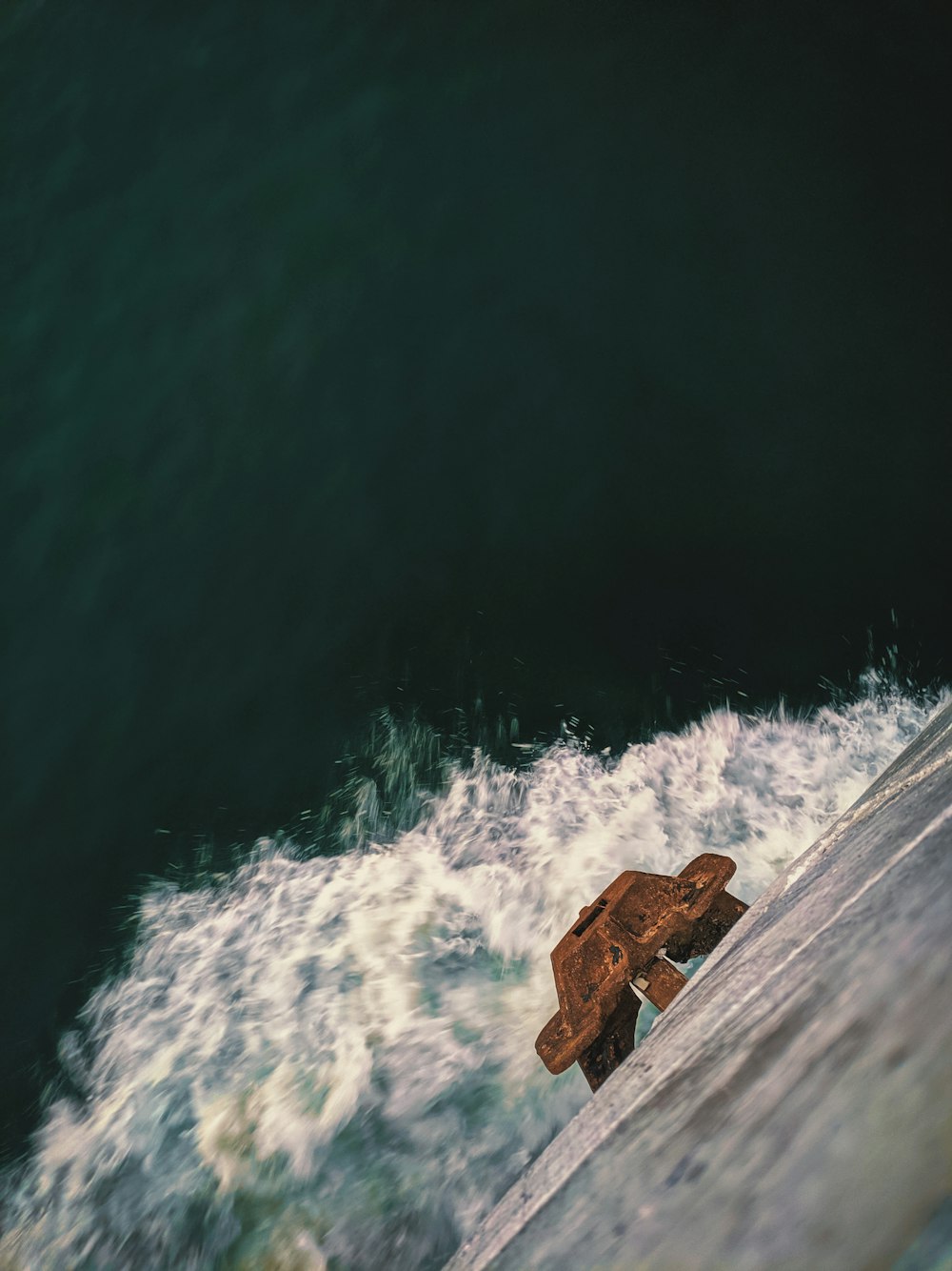 brown wooden dock on body of water during daytime