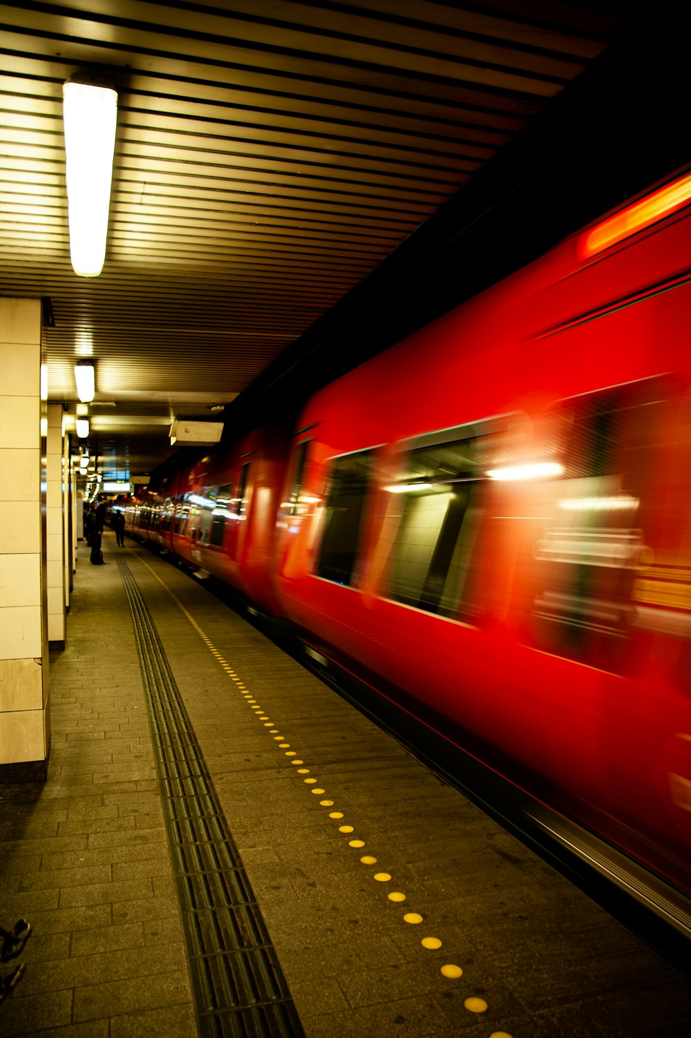 red and white train in train station