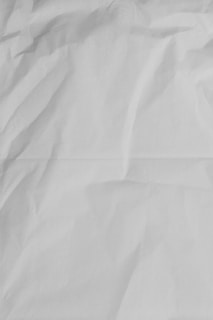 white printer paper on brown wooden table