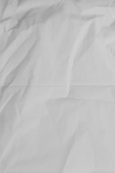 white printer paper on brown wooden table