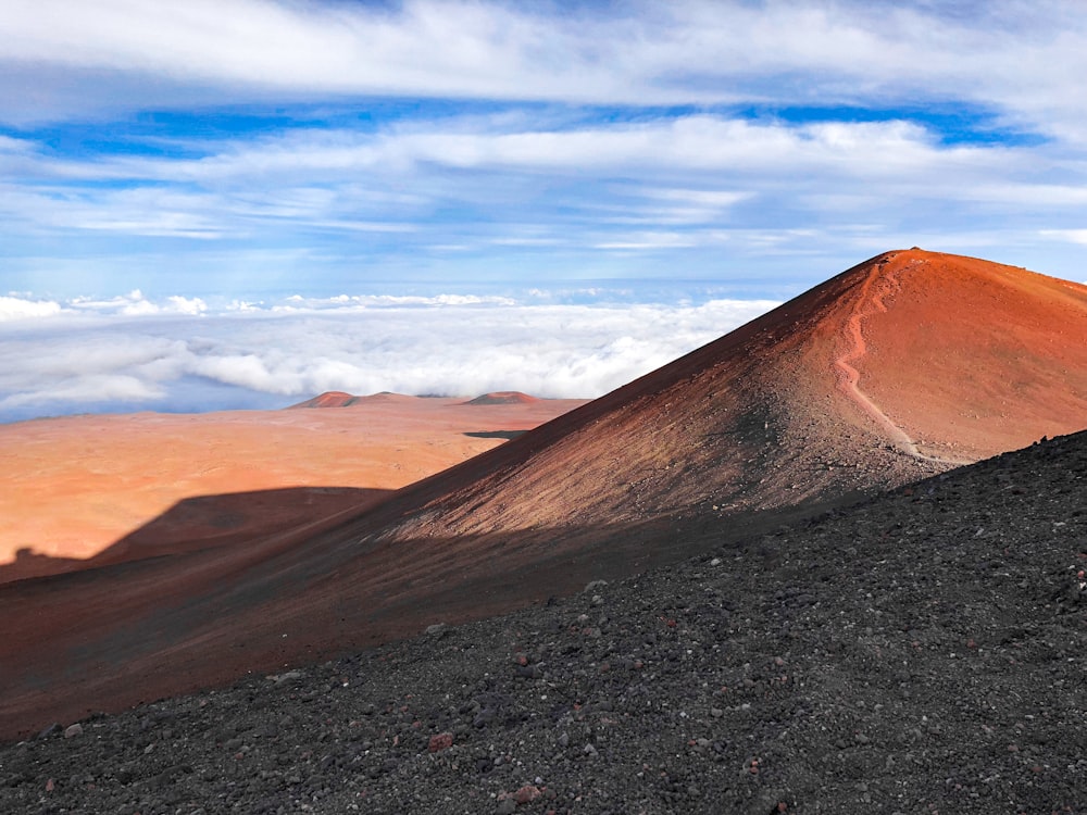 brown mountain under blue sky during daytime