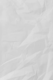 white textile on brown wooden table