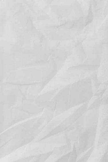 white textile on brown wooden table