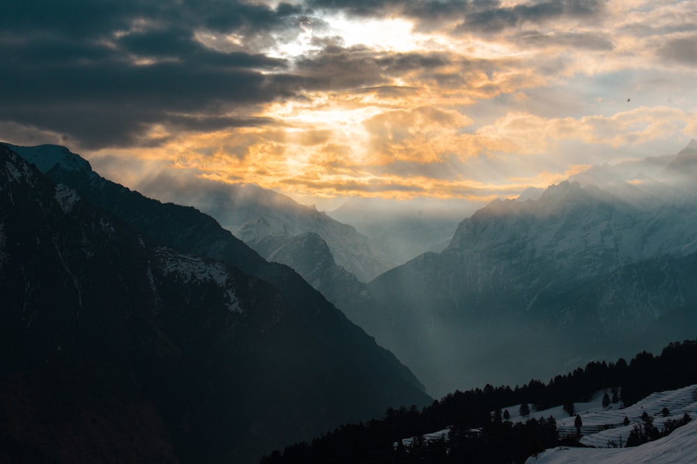 silhouette of mountains during sunset