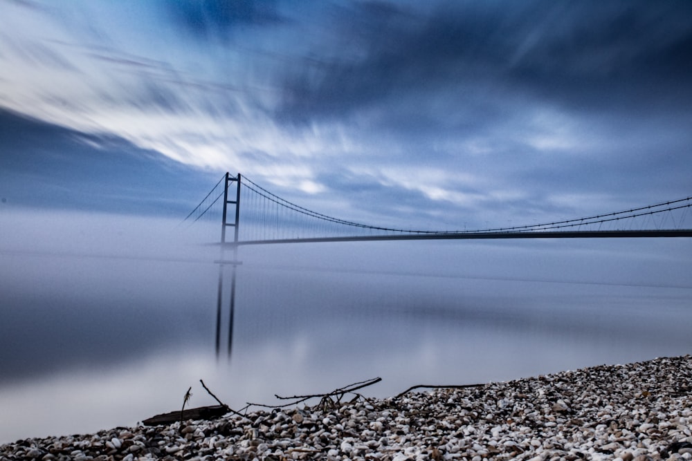 bridge over the lake under blue sky