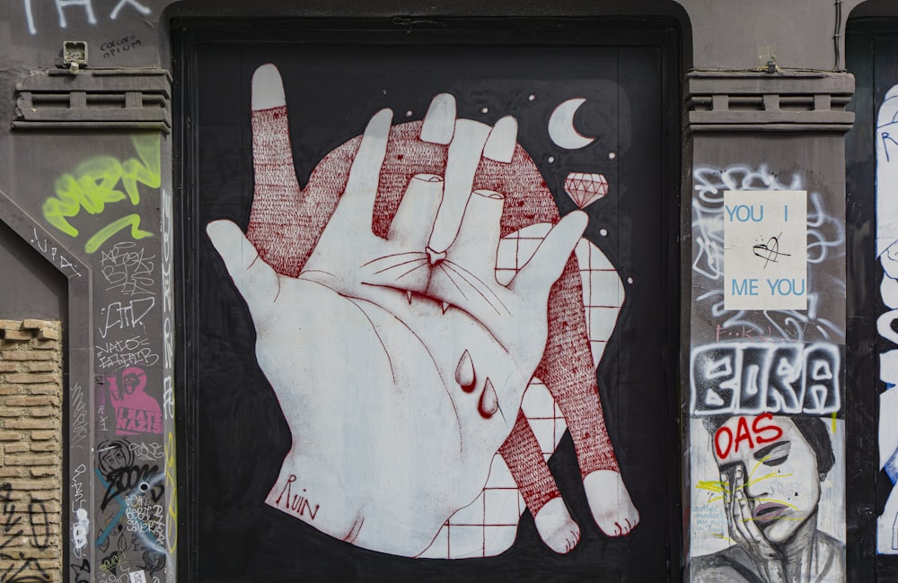 white and red hand print on black board